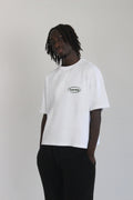 Model wearing hamby’s roll the dice tee in white. Oversize, boxy fit, 240gsm, 100% cotton. Hamby logo embroidered in green on front left chest. 