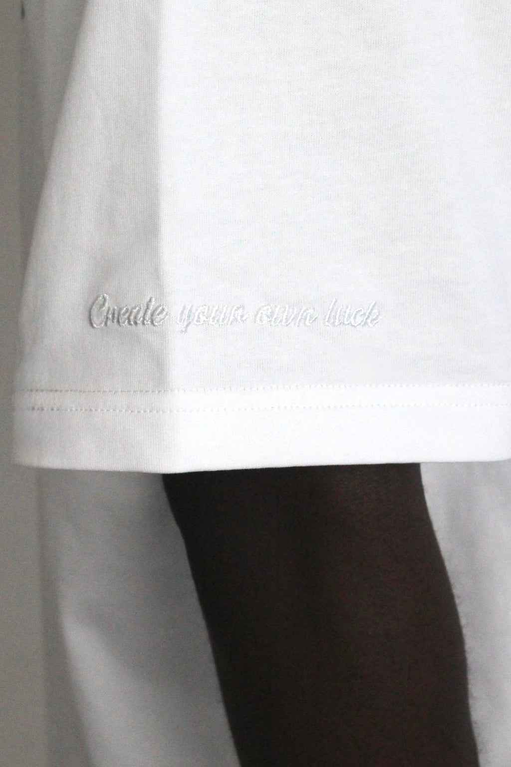 ‘Create your own luck’ embroidered in white on hamby’s roll the dice tee in white, to add a subtle bit of detailing. 
